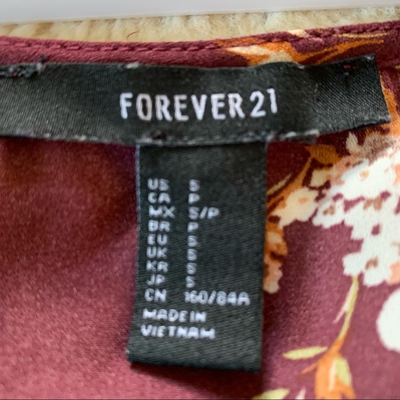 Forever 21 semi-sheer peplum blouse. Size: S - Picture 2 of 4